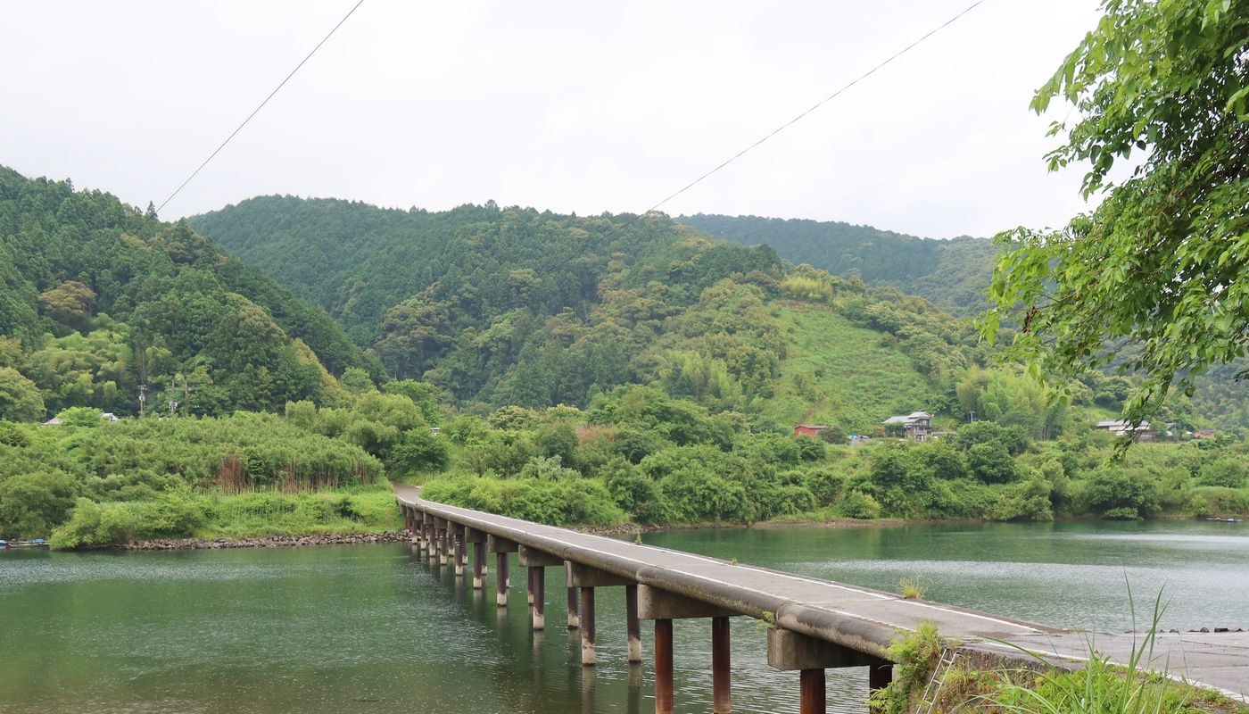 A low bridge crossing a calm river in Kochi Prefecture, Japan